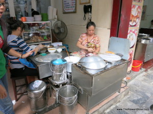 making steam rolled rice pancakes Hanoi Food Tour